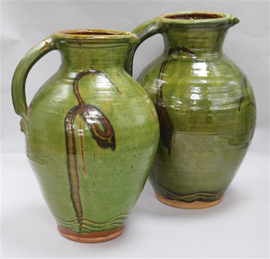 Clive Bowen. A pair of green glazed studio pottery jugs